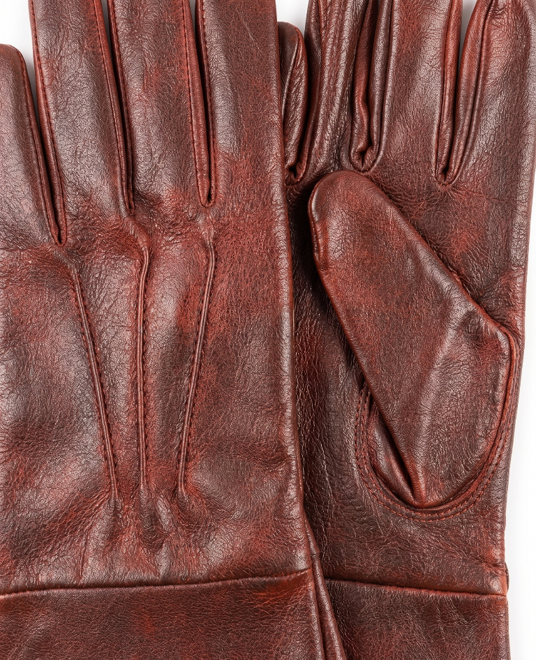Pair of brown leather gloves on a white background