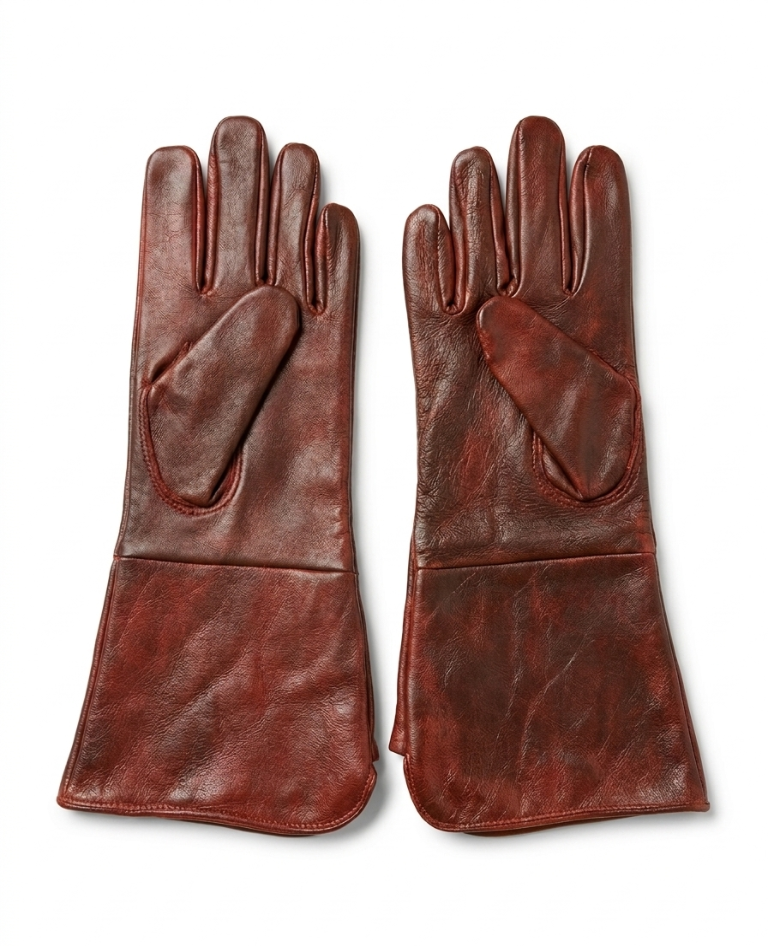 Pair of brown leather gloves on a white background
